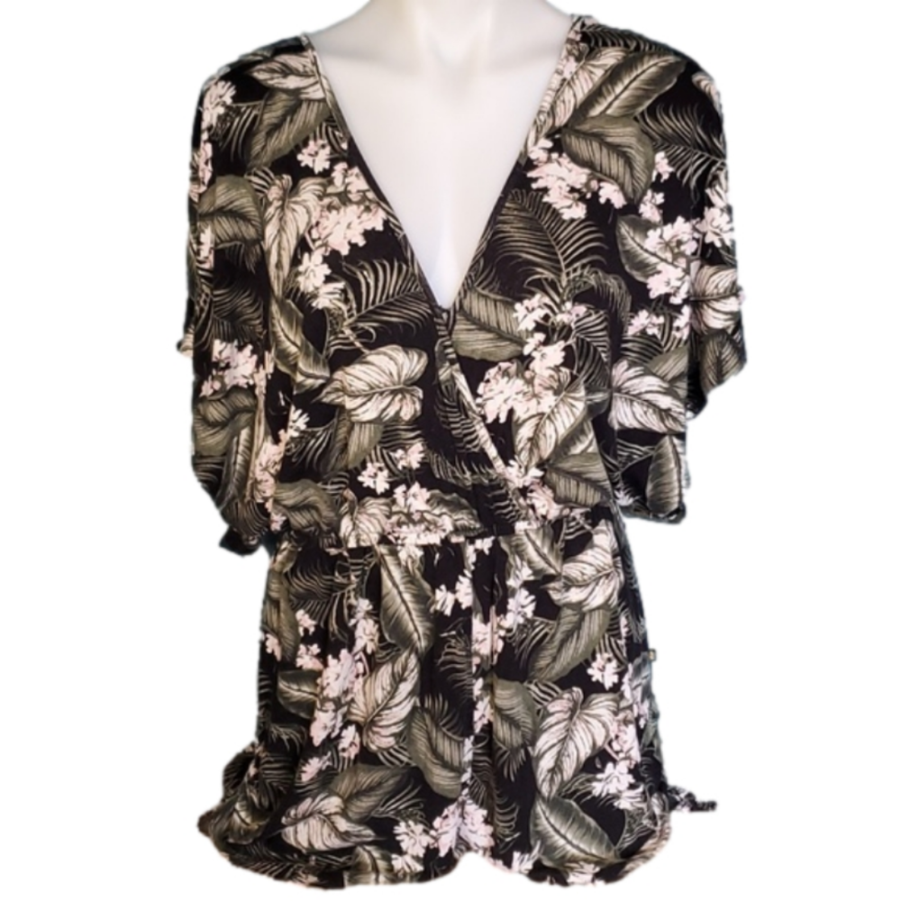 Tropical floral romper with tassles pink flower palm fronds and ferns